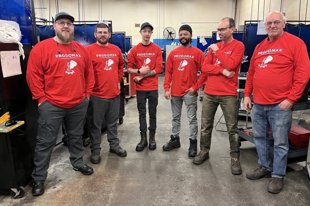 prodomax team standing in the machine shop