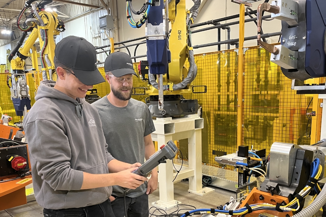 coop students using a machine remote