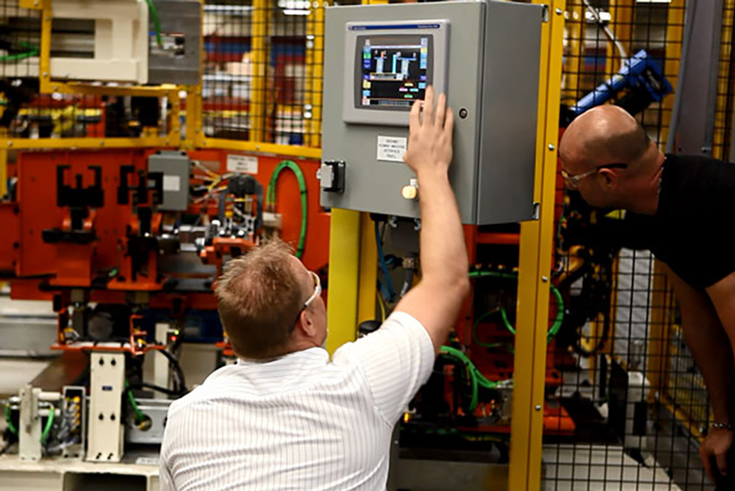 prodomax team adjusting an electrical panel